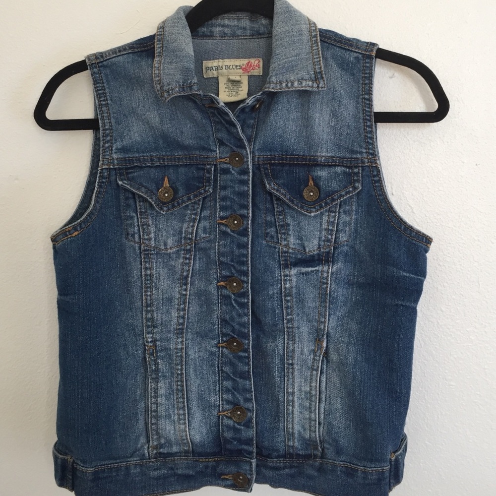 Blue sleeveless denim jacket.